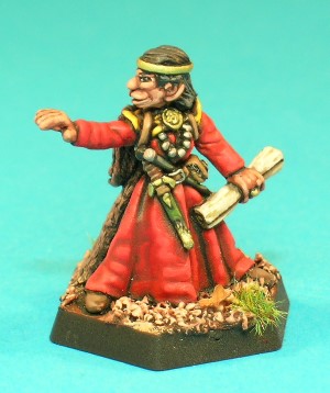 Pose 2 - The mid-level characterwears a new rope and a fur-lined cloak. He holds a parchment scroll in his left hand and has a magic wand thrust into his belt.