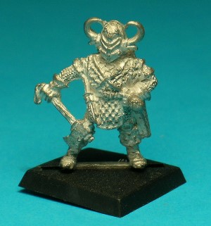Pose 1. This figure shows the low-level character wearing scalemail and obligatory evil horned helmet. He is armed with a simple hand axe and carries a sheathed dagger at his belt and a bow and arrows in a smart carrying case. He also has a backpack, short length of rope and a couple of small flasks.