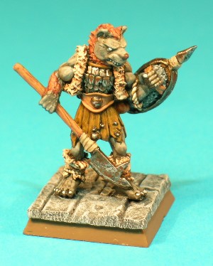 Figure 10, Gnoll.<br>This Gnoll is armed with a polearm and a spiked shield, and wears battered scale and leather armour. Although a nice figure, he is smaller than the Gnolls produced under the ADD55 code.