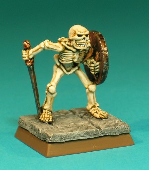 Figure 8, Skeleton.<br>This is a very nicely sculpted Skeleton, standing in a menacing pose, armed with a longsword and a battered shield.